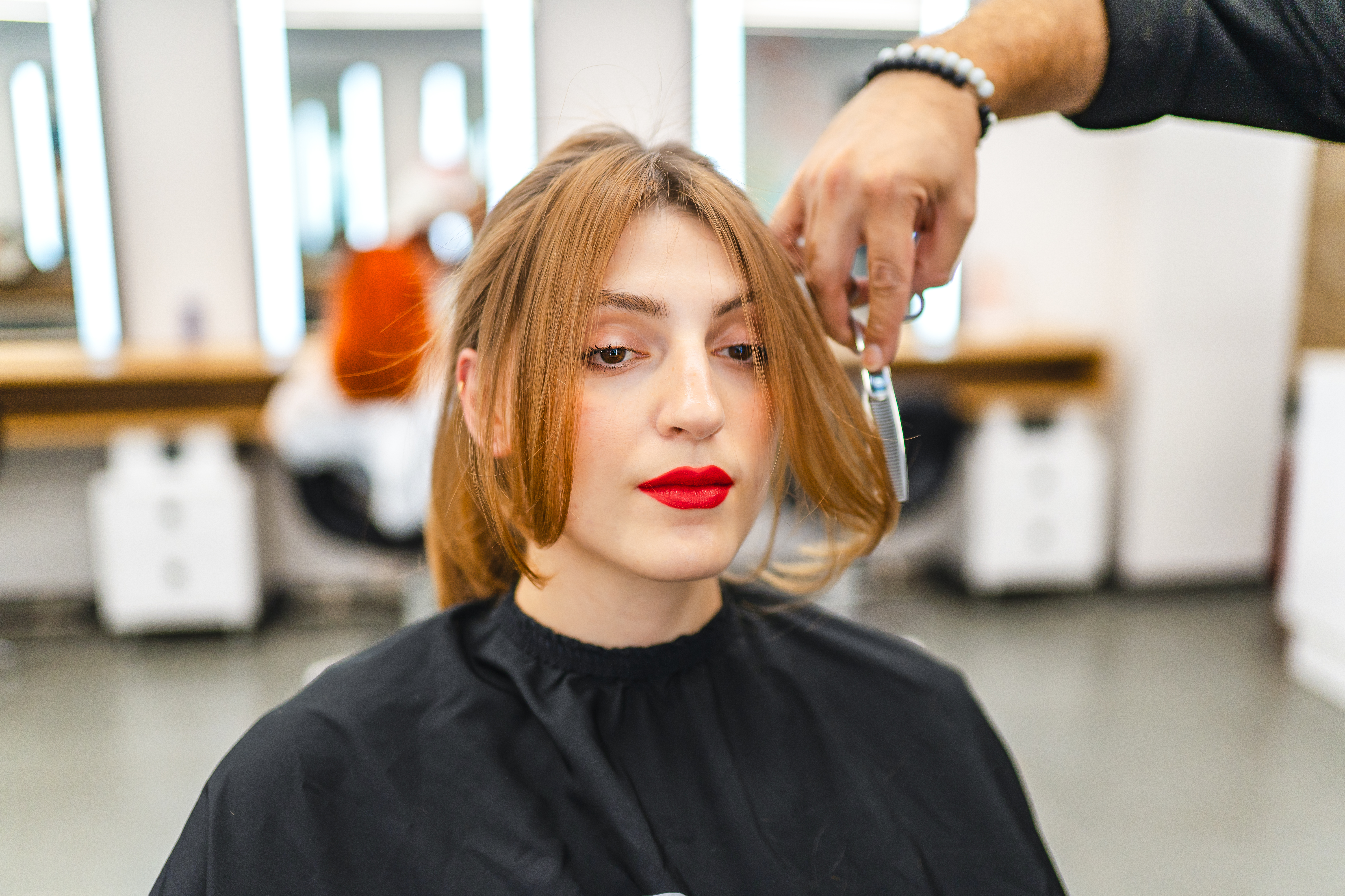 Image of woman getting her hair cut